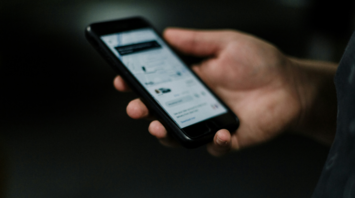 Man orders Uber taxi on his phone
