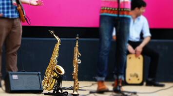 Musicians preparing for a concert on musical instruments