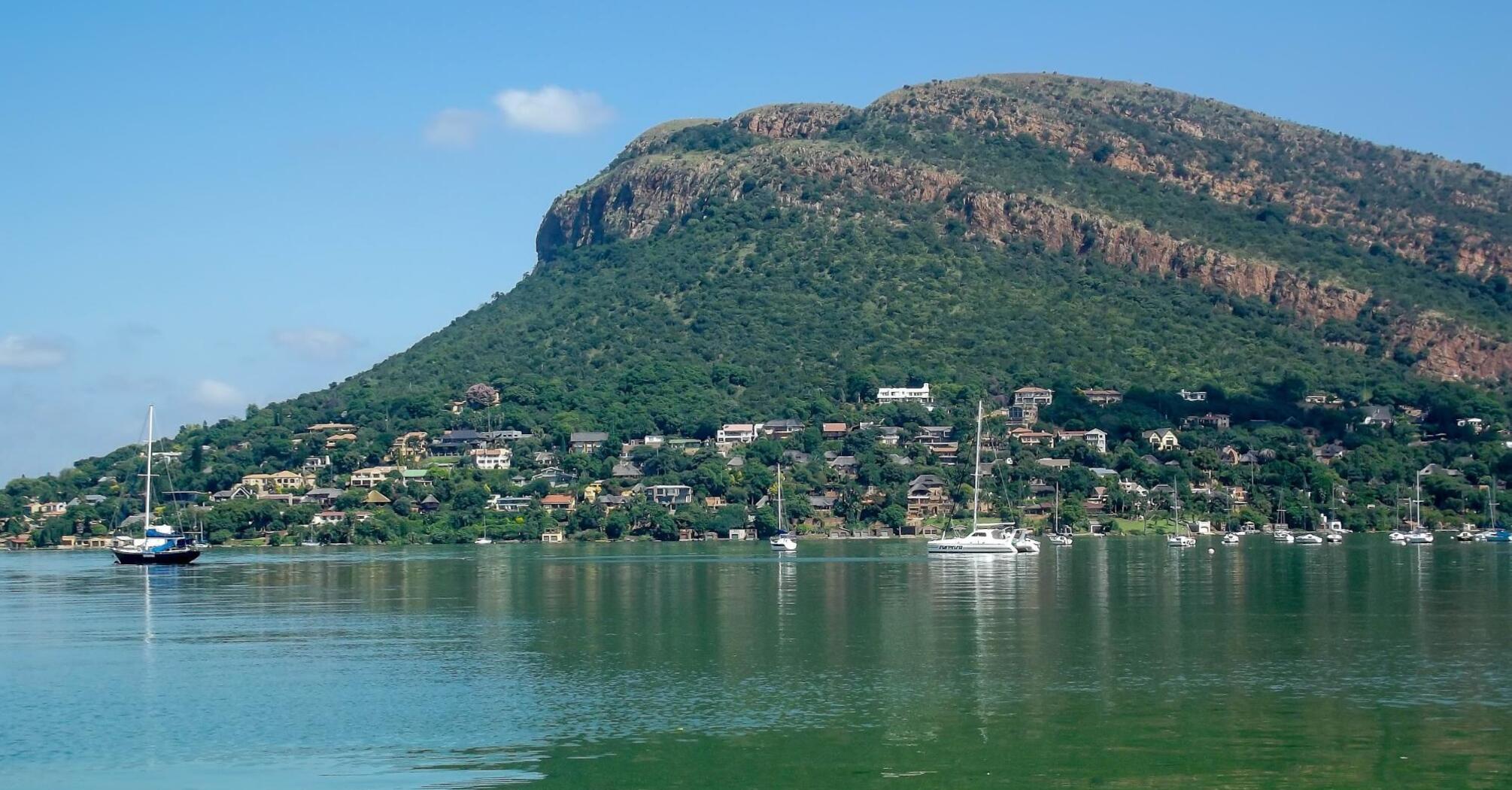 A village near the mountains and a reservoir