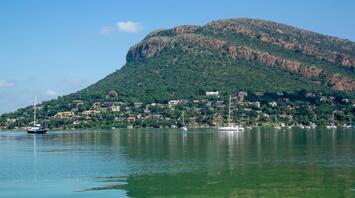 A village near the mountains and a reservoir