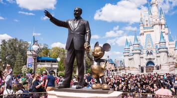 Large number of people near the Disney monument