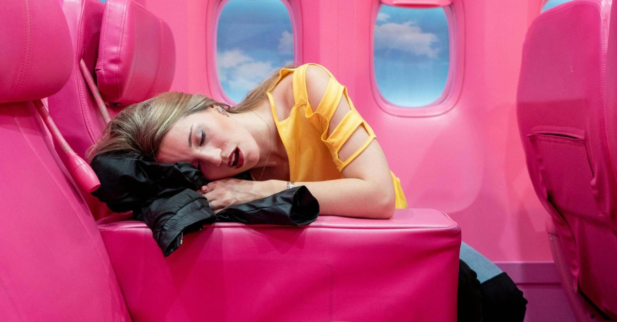 Sleeping woman on board an airplane