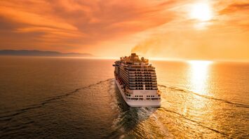 White cruise ship during sunset
