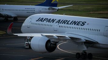 Japan Airlines aircraft being serviced on the tarmac