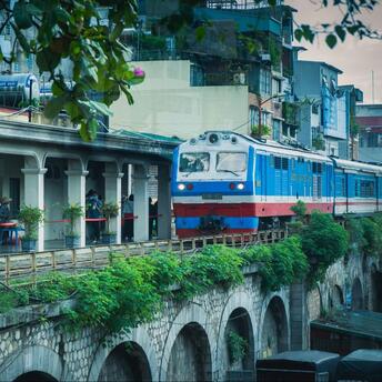 Blue train passing over the bridge