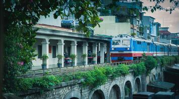 Blue train passing over the bridge