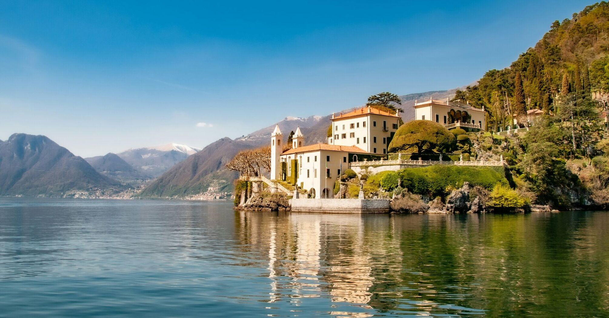 White building near body of water at the lake Como