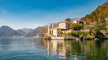 White building near body of water at the lake Como