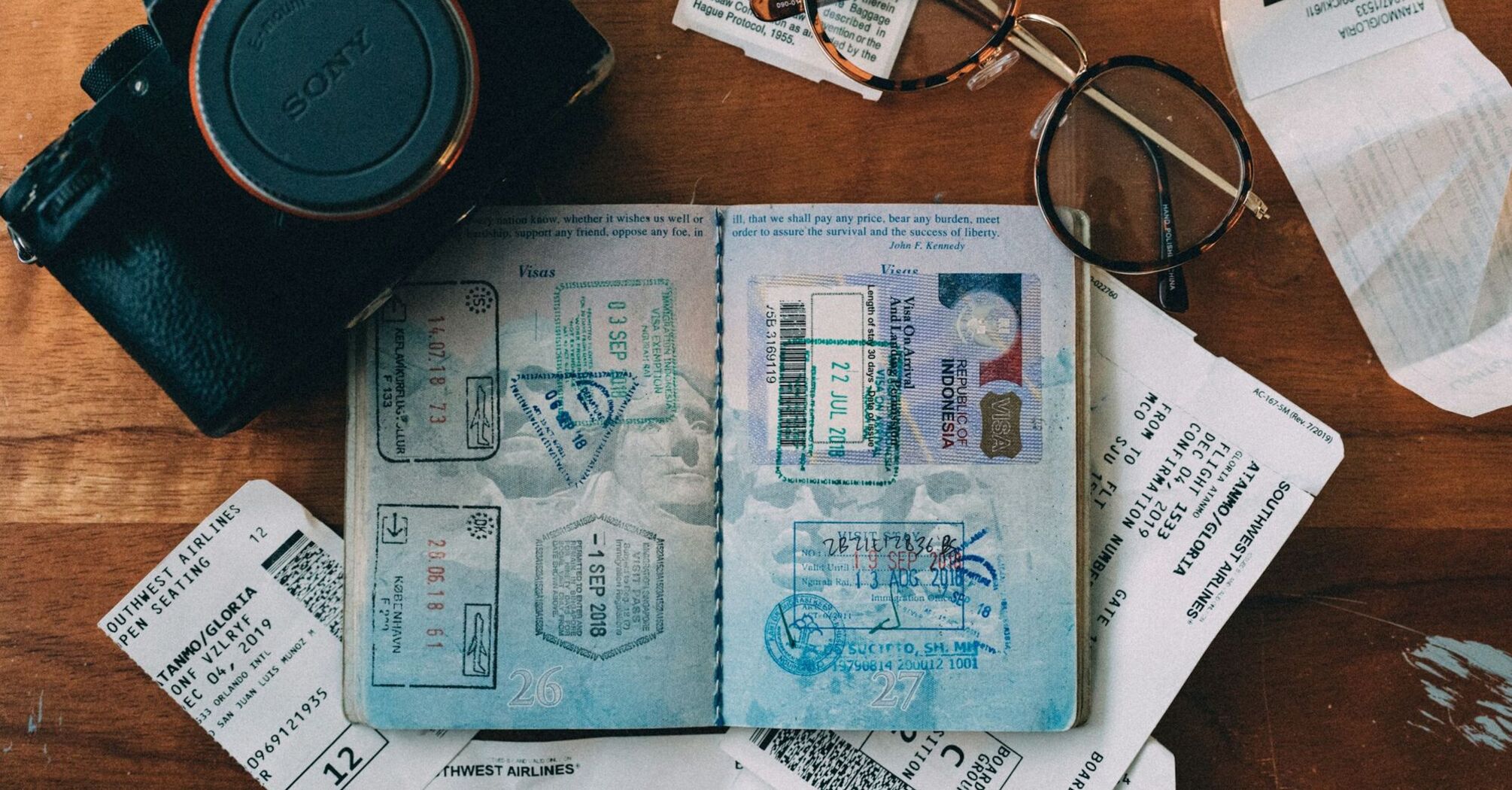 Travel essentials including passport and boarding passes