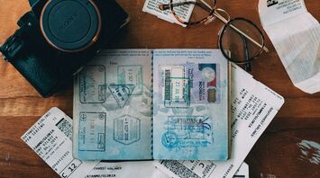 Travel essentials including passport and boarding passes