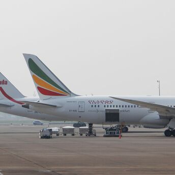 A large jetliner sitting on top of an airport tarmac