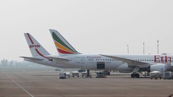 A large jetliner sitting on top of an airport tarmac