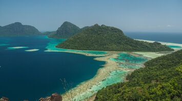 Green sea surrounded with mountains