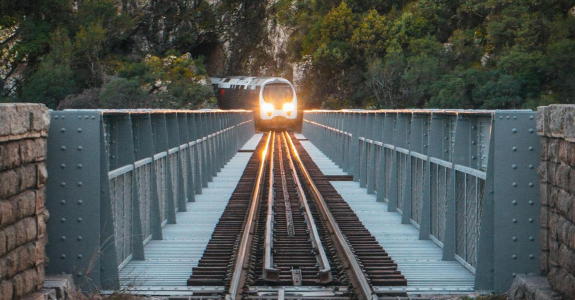 A high-speed train on a rail bridge