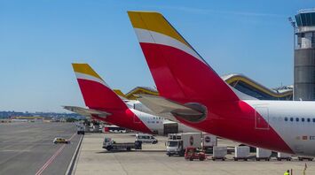 Iberia aircraft tails at an airport