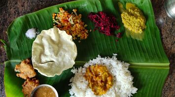 Indian food on green leaf