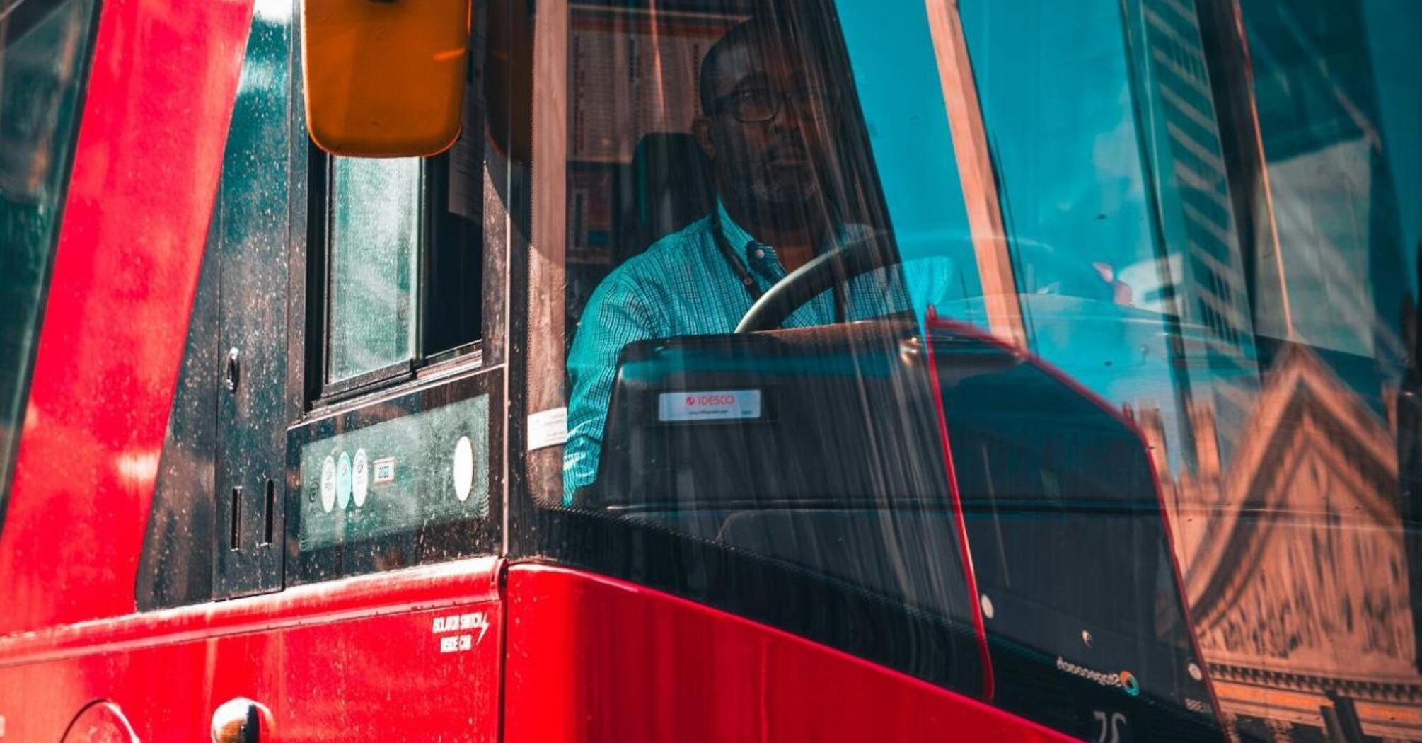 A driver sitting in the bus