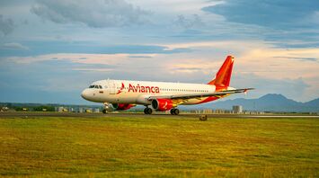 Avianca airplane on the runway at sunset