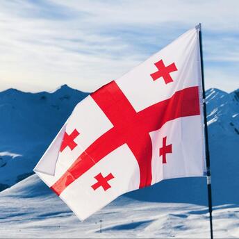 Georgian flag in the mountains