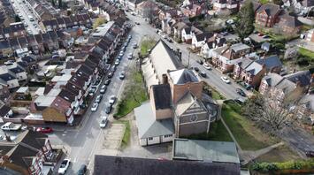 Aerial view of a residential neighborhood in Watford with a mix of houses and a church