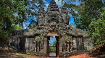 the entrance to an ancient Angkor Wat temple in the jungle