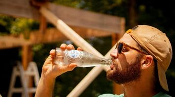 Man drinking water on the hot day