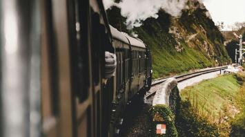 Team train traveling through a scenic landscape