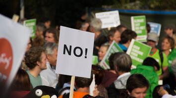 Protest Against Mass Tourism A crowd with placards at a rally in Ibiza