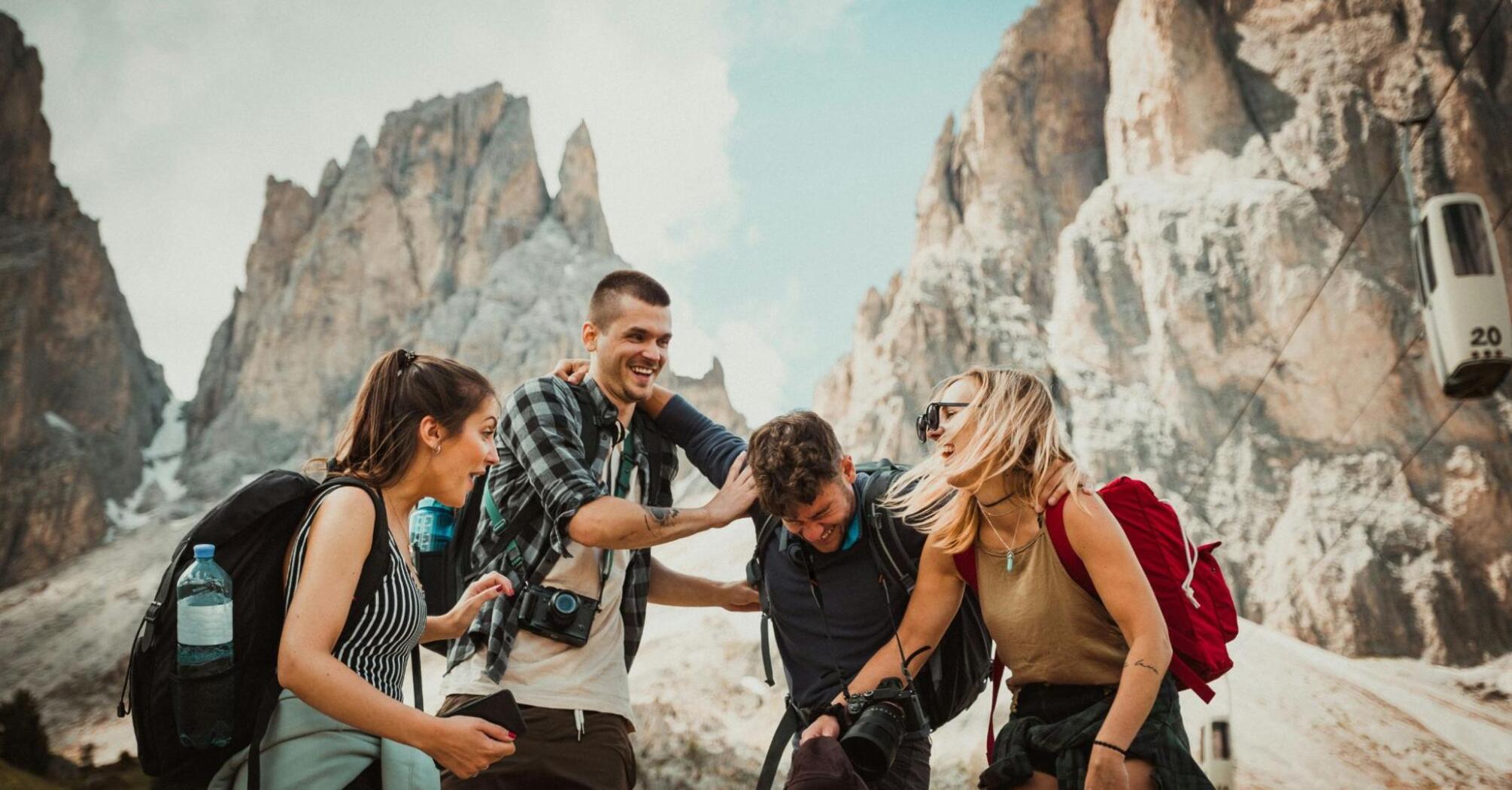 Group of people traveling mountains together
