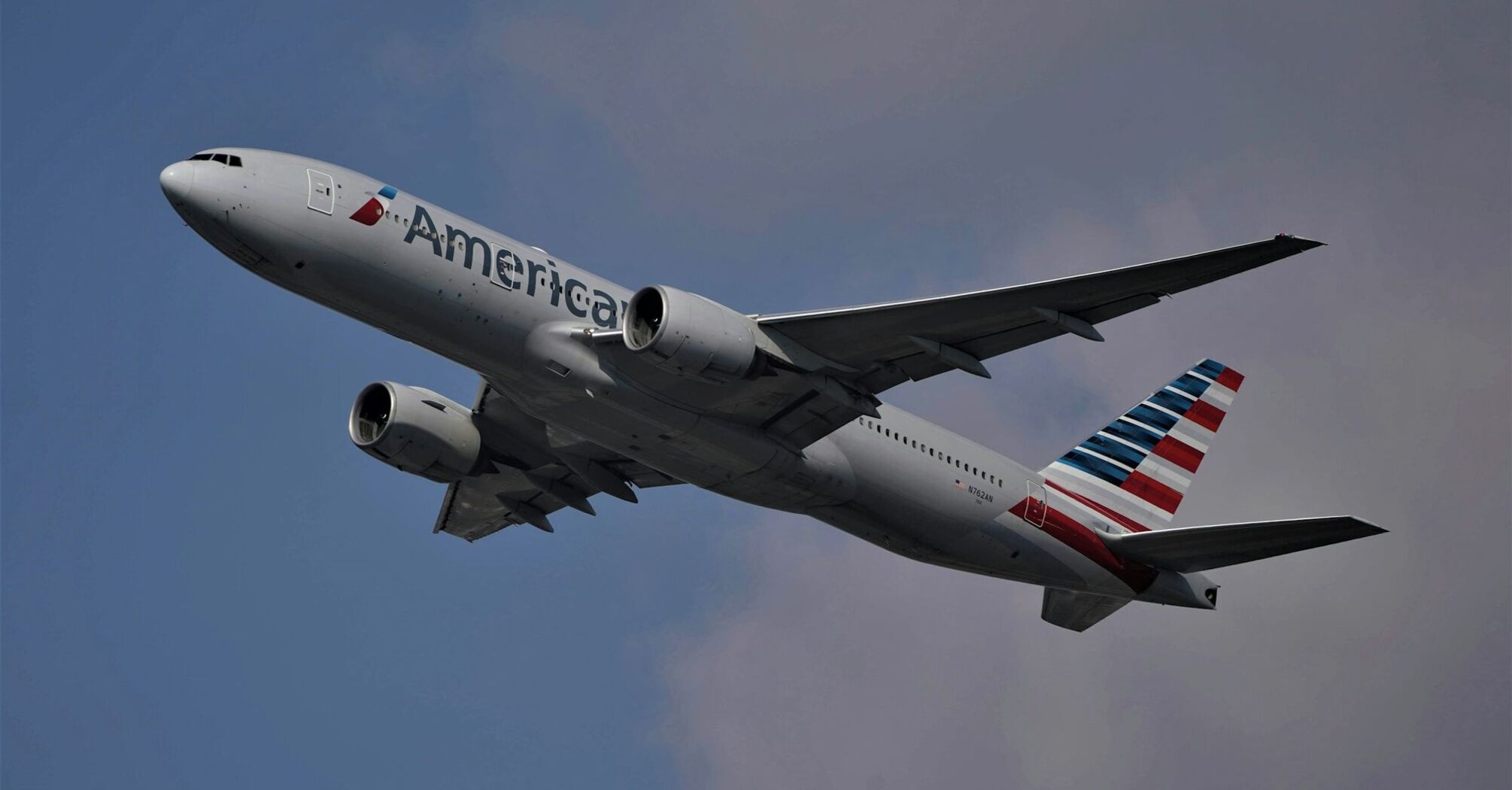 American Airlines plane flying in a clear sky