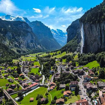 Picturesque view of Lauterbrunnen valley with Staubbach Falls and surrounding mountains