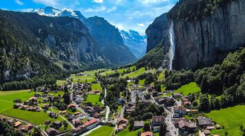 Picturesque view of Lauterbrunnen valley with Staubbach Falls and surrounding mountains