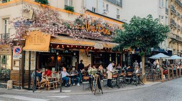 People having lunch in a street cafe in Paris