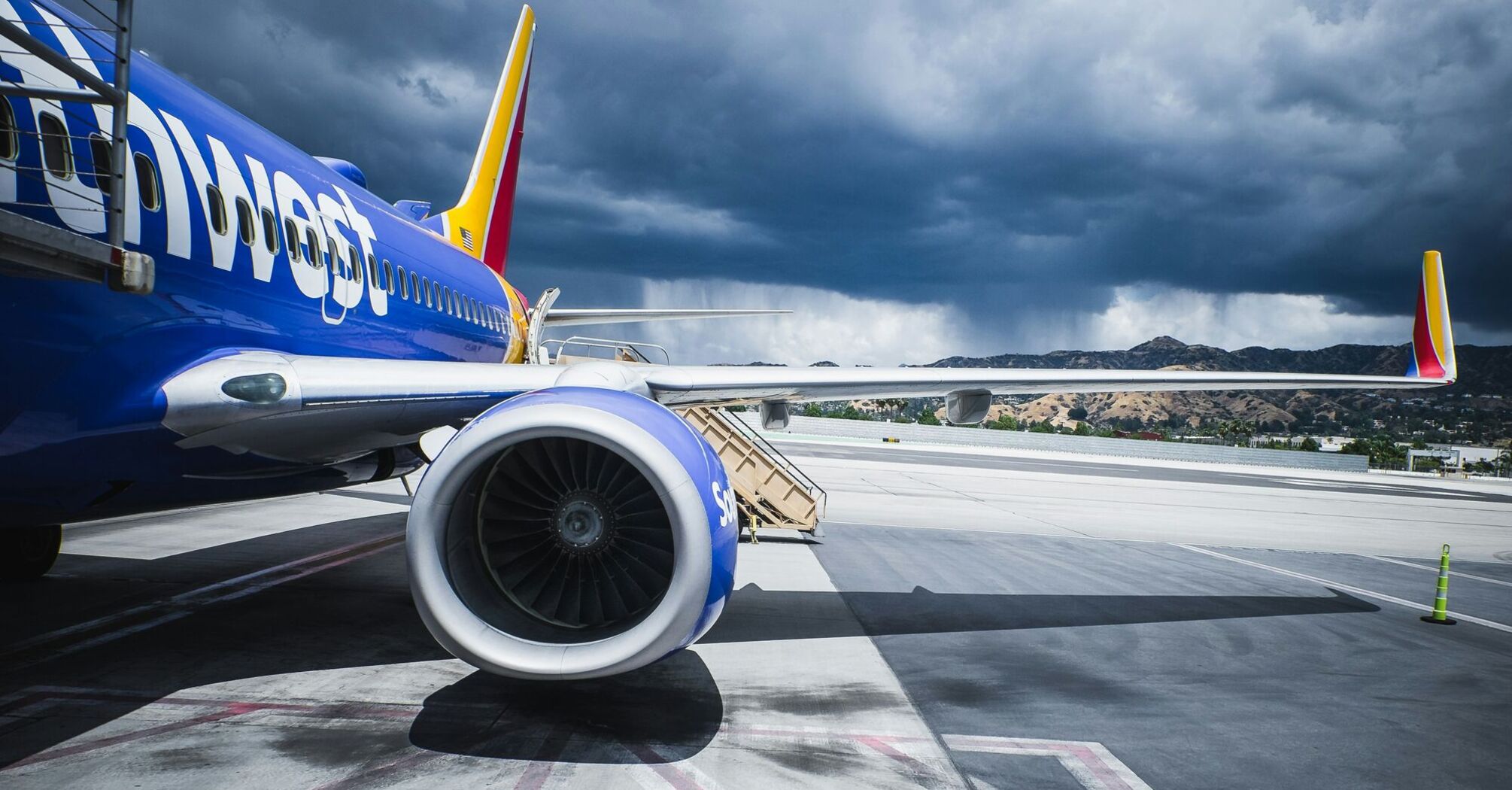 Southwest Airlines passenger plane on airport under gray cloudy sky