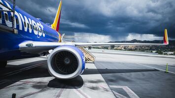 Southwest Airlines passenger plane on airport under gray cloudy sky