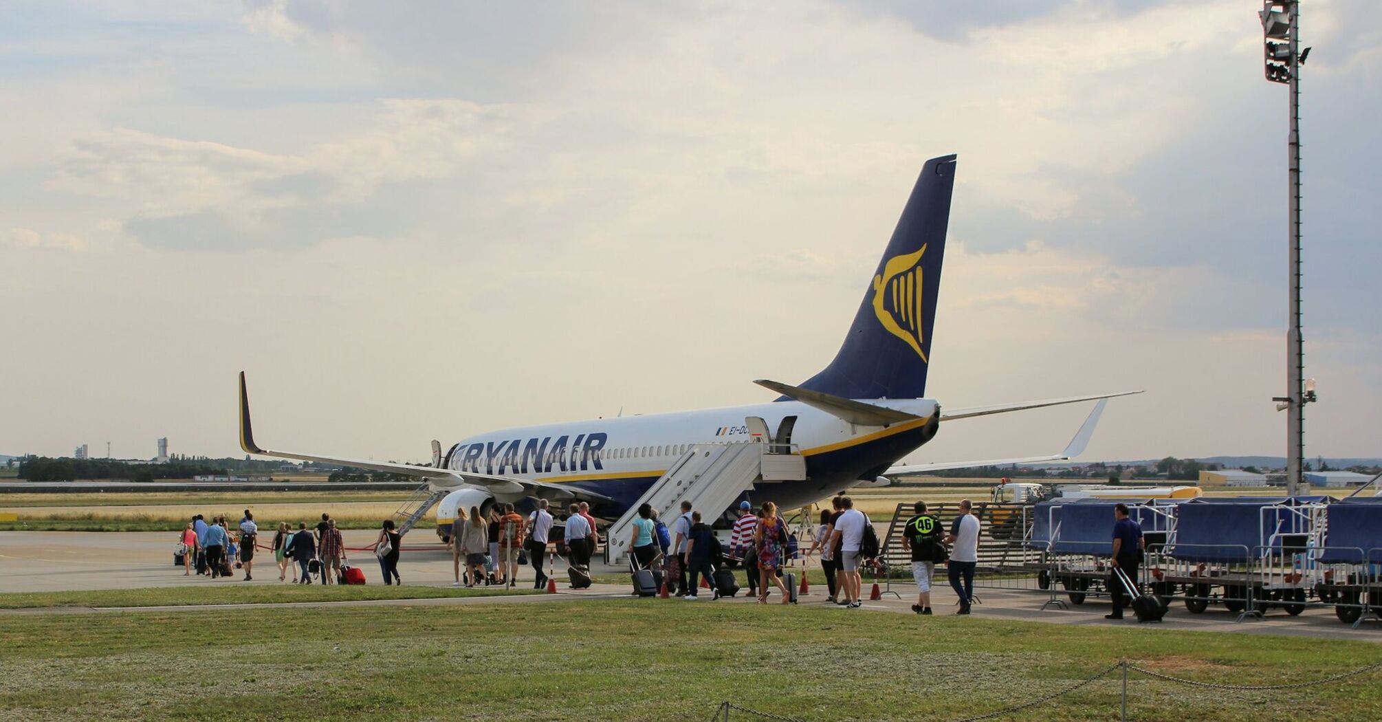 Passengers boarding a Ryanair aircraft on the tarmac