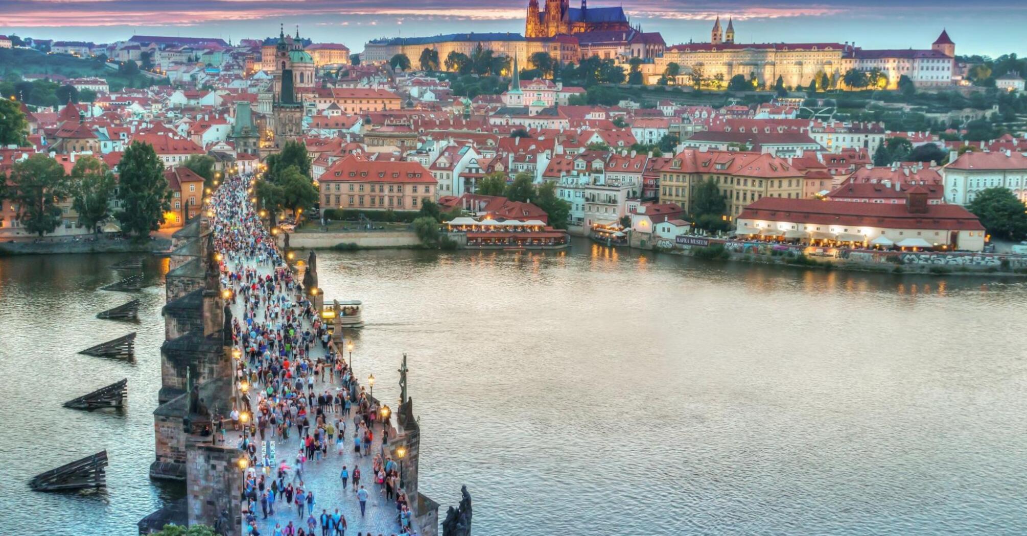Aerial view of the people walking on the bridge in Prague