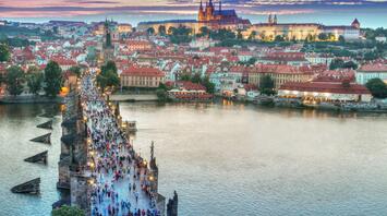 Aerial view of the people walking on the bridge in Prague