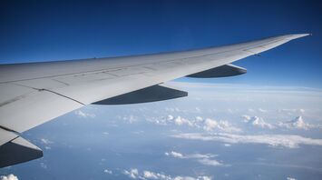 Airplane wing above the clouds during flight