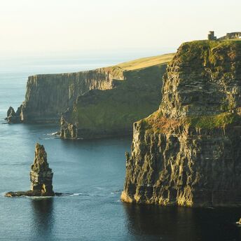 Sunlit Cliffs of Moher, Ireland, overlooking the Atlantic