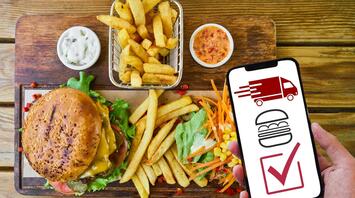 Burger and fries with a delivery call