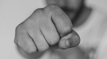 Close-up of a clenched fist in black and white