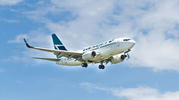 WestJet plane flying in the sky