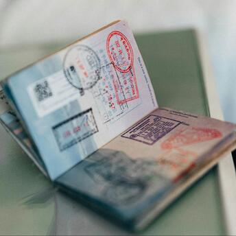 An unfolded visa lies on the table