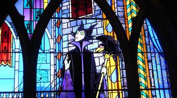 The evil stepmother with the raven from the famous fairy tale