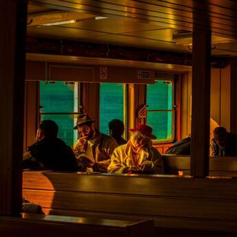 Sunlight warms the passengers of the ship