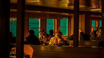 Sunlight warms the passengers of the ship