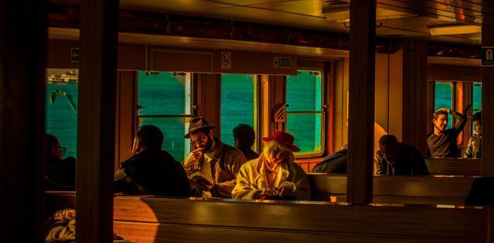 Sunlight warms the passengers of the ship