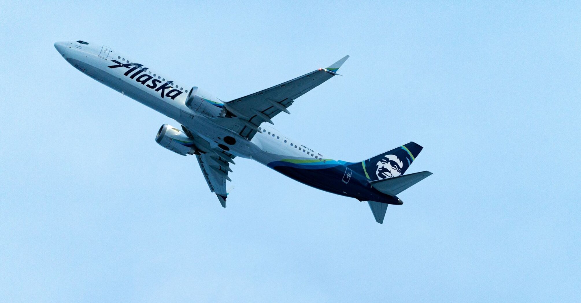 Alaska Airlines plane flying in the sky