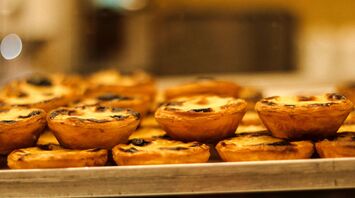 A tray of mini pies sitting on a table